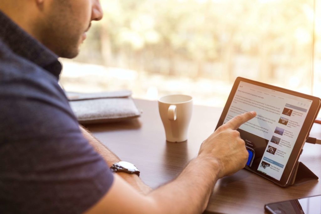 Photo of man searching the internet for a notary public